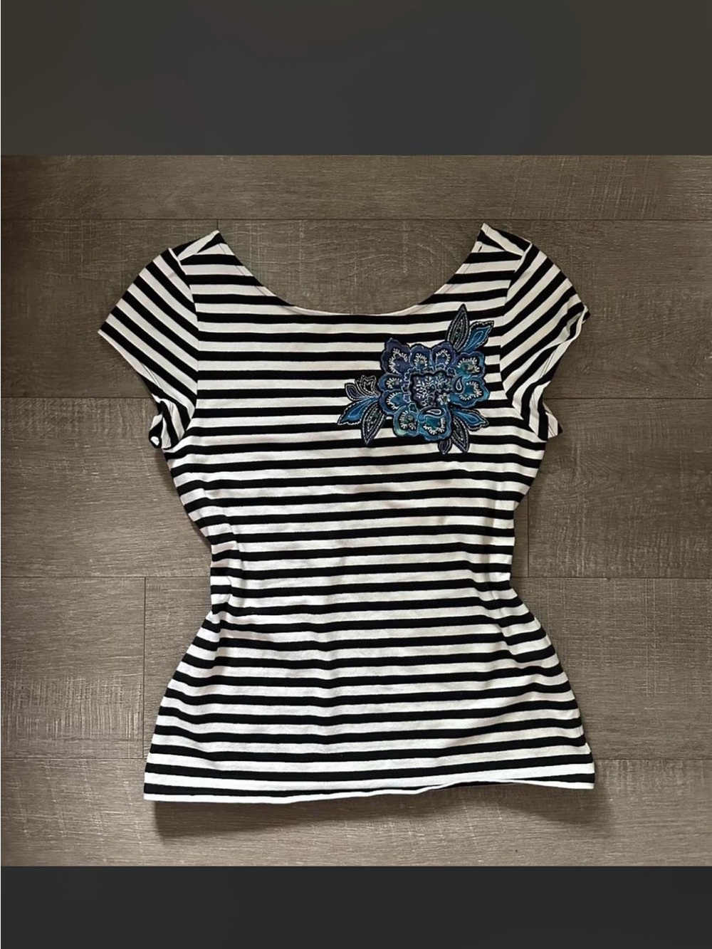 Gorgeous off the shoulder striped babydoll top with blue embroidered flower